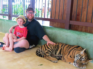 author and son with tigers