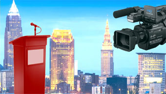 image composed by Thursday Review of Cleveland skyline with video camera and podium