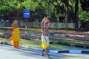 Carrying milk pots on heads