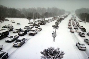 cars stuck in snow in traffic