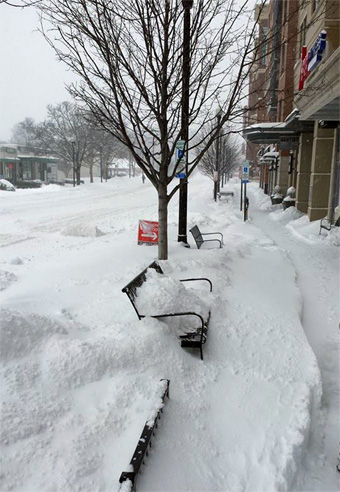 Heavy snow along a sidewalk in Washington DC